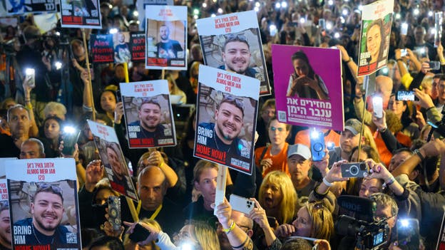 Tens of thousands gather with released Israeli hostages in Tel Aviv, call for release of victims