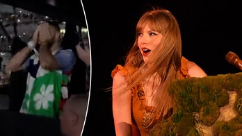 Taylor Swift surprises Travis Kelce at concert, pleads with fans to stop throwing things on stage