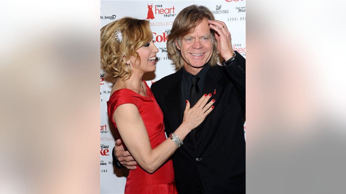 Actress Felicity Huffman and husband William H. Macy attends "The Heart Truth's" Red Dress Collection 2010 fashion show on Thursday, Feb. 11, 2010 in New York. (AP Photo/Evan Agostini)