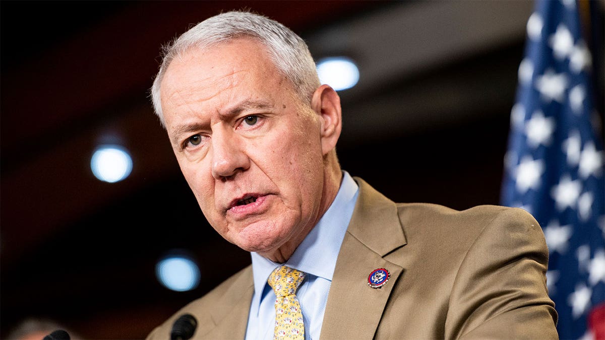 Rep. Ken Buck, R-Colo., speaking into a microphone