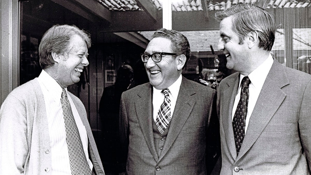 Jimmy Carter, Henry Kissinger, and Walter Mondale as they meet for a foreign policy briefing