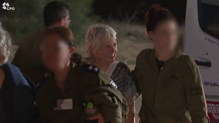 Israel-Hamas war: Video shows 13 hostages arriving to Hatzerim Air Force Base