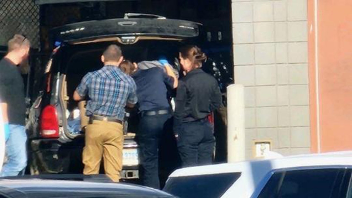 Law enforcement looking through items in Katie Ferguson's ex-boyfriend's truck