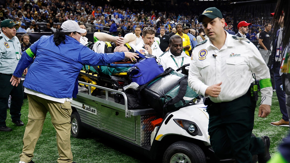 NFL official in pain as he's stretchered off field