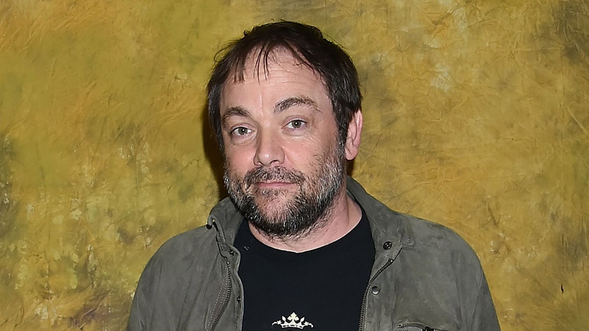 Mark Sheppard sports black shirt and jacket