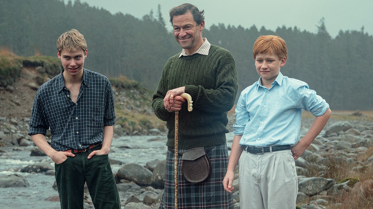 Rufus Kampa, Dominic West, and, Fflyn Edwards in a scene from The Crown